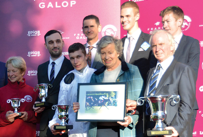 Members' and Luke Morris collecting the trophy after a Marsha win.